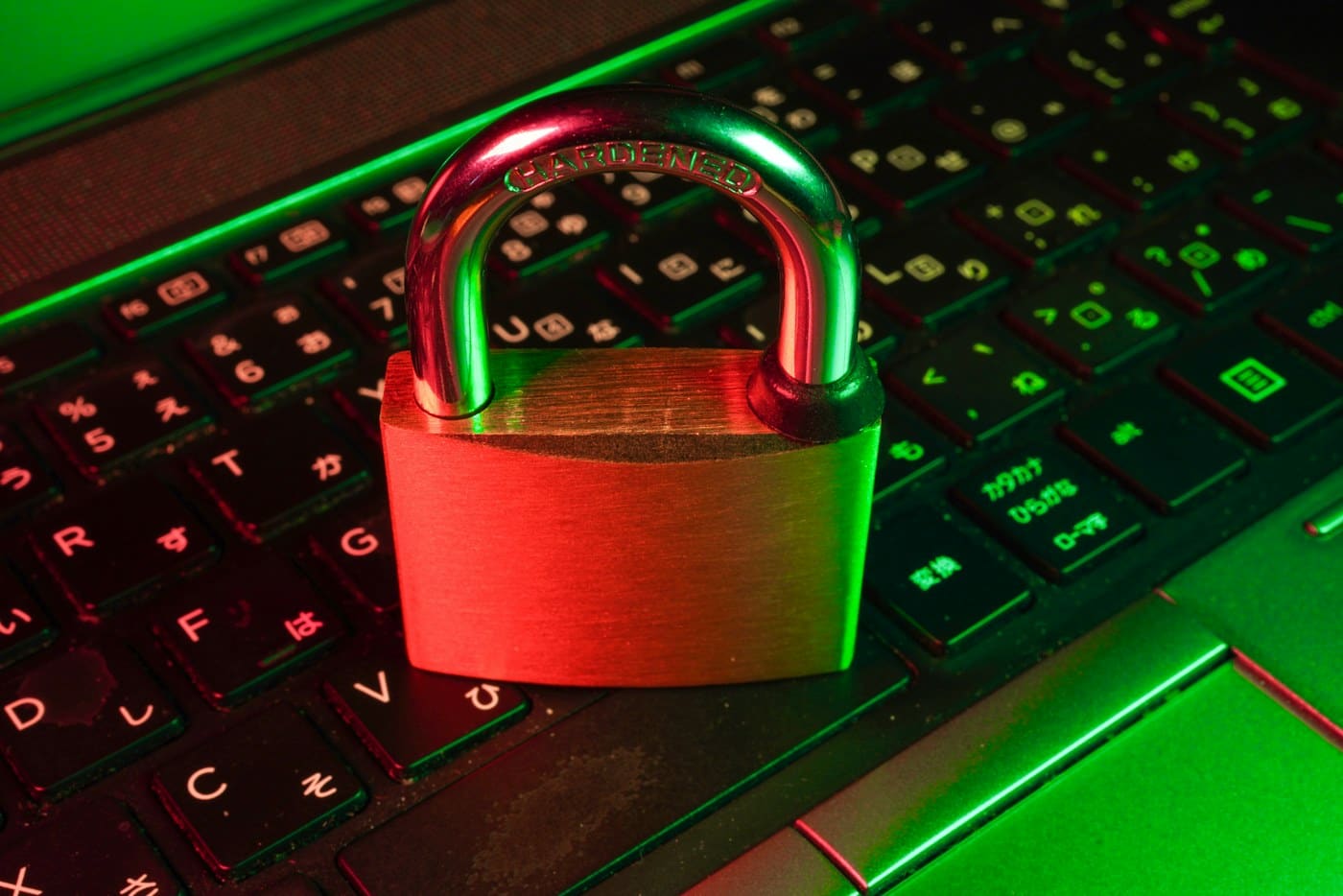 Padlock resting on a laptop keyboard, illustrating be1crypto.com account security duties